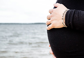 Woman holding her stomach